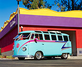 AUT 21 RK1635 03
1957 Volkswagen Bus Custom Light Blue With Graphics 3/4 Front View On Pavement By Building