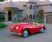 AUT 21 RK1676 02
1951 Jowett Jupiter Roadster Red 3/4 Front View On Driveway By House
