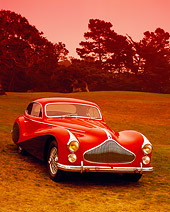 AUT 21 RK1788 01
1951 Talbot-Lago T26 Grand Sport Red And Black 3/4 Front View On Grass By Trees