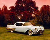 AUT 21 RK1798 01
1957 Cadillac Fleetwood Light Blue 3/4 Front View On Grass By Trees