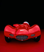 AUT 21 RK1825 07
1953 Giaur Champion Red Head On Shot On Red Floor Studio