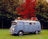 AUT 21 RK1831 01
1958 Volkswagen Double Door Bus Dove Blue 3/4 Side View On Grass Trees Background