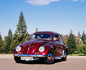 AUT 21 RK1838 01
1956 Volkswagen Oval Bug Red 3/4 Front View On Pavement Trees Background