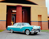 AUT 21 RK1850 02
1955 Crown Victoria Skyliner Two Tone Green 3/4 Side View On Pavement By Building