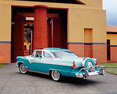 AUT 21 RK1851 06
1955 Ford Crown Victoria Skyliner Two Tone Green 3/4 Rear View On Pavement By Building