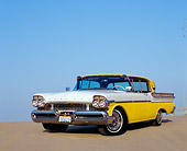 AUT 21 RK1861 03
1957 Mercury Turnpike Cruiser Yellow And White Low 3/4 Front View On Pavement Blue Sky