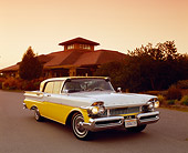 AUT 21 RK1866 03
1957 Mercury Turnpike Cruiser Yellow And White Front 3/4 View On Pavement By Building And Trees