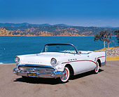 AUT 21 RK1877 01
1957 Buick Roadmaster Convertible White 3/4 Front View On Pavement By Lake