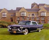 AUT 21 RK1888 02
1957 Cadillac Brougham Dark Blue 3/4 Front View On Grass By Building