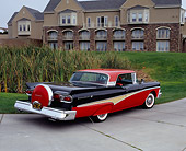 AUT 21 RK1894 03
1958 Ford Skyliner Red And Black 3/4 Rear View On Pavement By Building