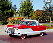 AUT 21 RK1906 02
1959 Nash Metropolitan Red And White 3/4 Side View On Pavement
