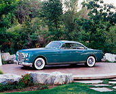 AUT 21 RK1910 01
1953 Chrysler Ghia Teal 3/4 Side View By Rocks And Trees