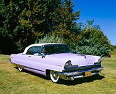 AUT 21 RK1924 02
1956 Lincoln Premier Convertible Light Purple Front 3/4 View On Grass By Trees