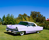 AUT 21 RK1925 01
1956 Lincoln Premier Convertible Light Purple Side 3/4 View On Grass By Trees