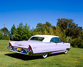 AUT 21 RK1926 01
1956 Lincoln Premier Convertible Light Purple Rear 3/4 View On Grass By Trees