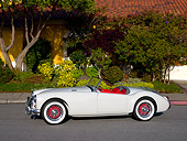 AUT 21 RK1956 01
1959 MG MGB Convertible Gray Red Interior 3/4 Side View On Pavement