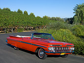 AUT 21 RK1998 01
1959 Chevrolet Impala Convertible Red 3/4 Front View On Pavement By Trees