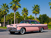 AUT 21 RK2008 01
1956 De Soto Fireflite Sportsman Pink Low 3/4 Side View On Pavement By Palm Trees