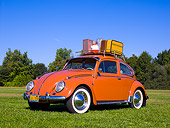 AUT 21 RK2028 01
1958 Volkswagen Beetle Coral Low 3/4 Front View On Grass Trees Background