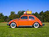 AUT 21 RK2030 01
1958 Volkswagen Beetle Coral Profile View On Grass Trees Background