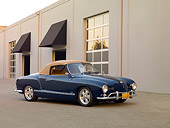 AUT 21 RK2031 01
1959 Volkswagen Karmann Ghia 141 Convertible Blue 3/4 Side View On Pavement By Building