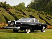 AUT 21 RK2119 01
1955 Ford Crown Victoria Black Rear 3/4 View On Grass By Shrubs Tree Sky