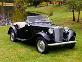 AUT 21 RK2120 01
1950 MG TD Black Front 3/4 View On Grass By Water Trees