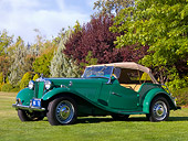 AUT 21 RK2124 01
1954 MG TD Green Front 3/4 View On Grass By Trees Sky