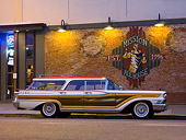 AUT 21 RK2142 01
1959 Mercury Colony Park Wagon White & Red With Woodgrain Paneling Profile View On Pavement By Building