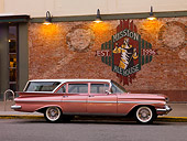 AUT 21 RK2143 01
1959 Chevrolet Parkwood Wagon Pink & White Profile View On Pavement By Building
