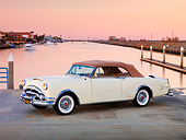 AUT 21 RK2177 01
1953 Packard Caribbean Convertible Ivory 3/4 Front View By Water