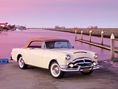 AUT 21 RK2180 01
1953 Packard Caribbean Convertible Ivory 3/4 Front View By Water