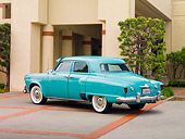 AUT 21 RK2201 01
1952 Studebaker Commander Green 3/4 Rear View By Building
