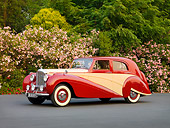 AUT 21 RK2214 01
1951 Bentley Mk VI Harold Radford Countryman Saloon Maroon & Tan 3/4 Front View By Flowering Shrubs