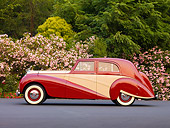 AUT 21 RK2215 01
1951 Bentley Mk VI Harold Radford Countryman Saloon Maroon & Tan Profile View By Flowering Shrubs