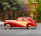 AUT 21 RK2216 01
1951 Bentley Mk VI Harold Radford Countryman Saloon Maroon & Tan Profile View By Building