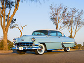 AUT 21 RK2233 01
1954 Chevrolet Bel Air Sport Coupe Turquoise 3/4 Front View By Trees