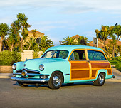 AUT 21 RK2276 01
1950 Ford Woody Station Wagon Green 3/4 Front View On Pavement By Palm Trees