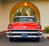 AUT 21 RK2288 01
1955 Mercury Montclair Red And White Front View On Pavement By Building