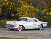AUT 21 RK2296 01
1957 Buick Roadmaster Convertible White 3/4 Front View On Road By Trees