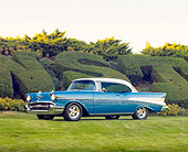 AUT 21 RK2301 01
1957 Chevrolet Bel Air Hardtop Blue And White 3/4 Front View On Grass By Hedge