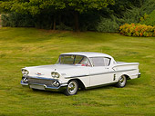 AUT 21 RK2303 01
1958 Chevrolet Impala Hardtop White 3/4 Front View On Grass By Trees