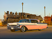 AUT 21 RK2319 01
1957 Mercury Turnpike Cruiser White And Pink 3/4 Front View On Pavement By Train