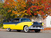 AUT 21 RK2330 01
1956 Ford Fairlane Convertible Black And Yellow 3/4 Front View On Pavement By Autumn Trees