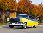 AUT 21 RK2332 01
1956 Ford Fairlane Convertible Black And Yellow 3/4 Front View On Pavement By Autumn Trees
