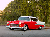 AUT 21 RK2335 01
1955 Chevrolet Bel Air Red And White 3/4 Front View On Pavement By Trees