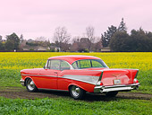 AUT 21 RK2344 01
1957 Chevrolet Bel Air Red 3/4 Rear View In Field Of Yellow Wildflowers