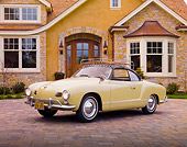 AUT 21 RK2351 01
1958 Volkswagen Karmann Ghia Beige 3/4 Front View On Driveway By House