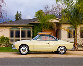 AUT 21 RK2354 01
1958 Volkswagen Karmann Ghia Beige Profile View On Gravel By House