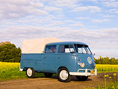 AUT 21 RK2360 01
1959 Volkswagen Binz Double Cab Bus Blue 3/4 Front View By Field Of Yellow Wildflowers
